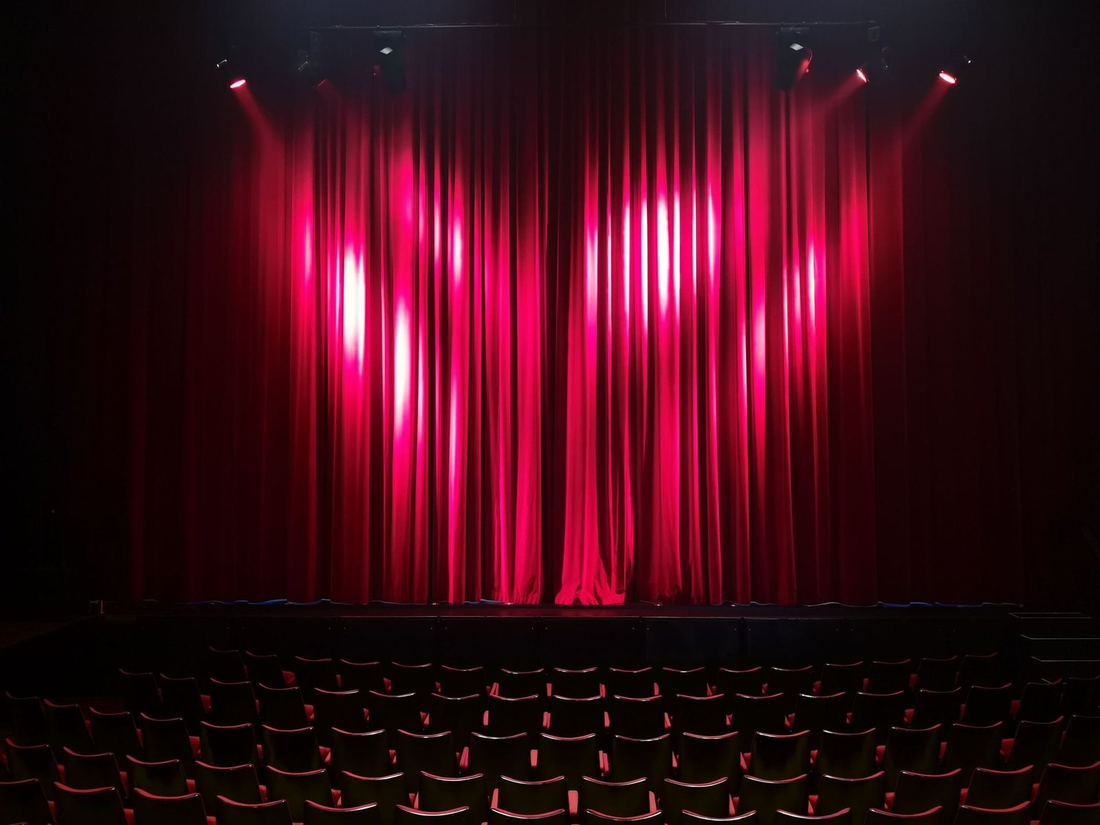 Theatre stage with red curtains